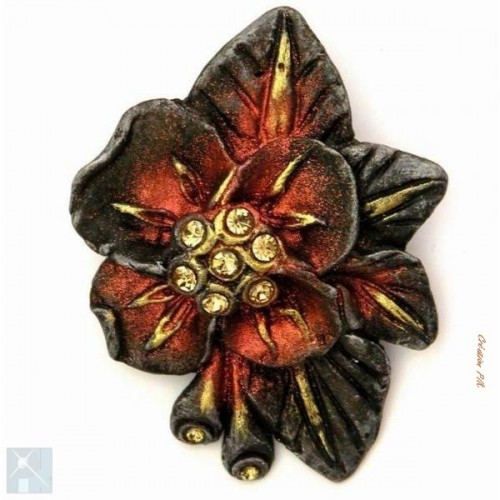 Broche en résine de couleur cuivré, or et bronze.