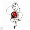 Broche de créateur avec une pierre rouge rubis.