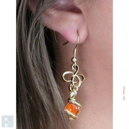 Boucles d'oreilles en fils entrelacés, oranges.